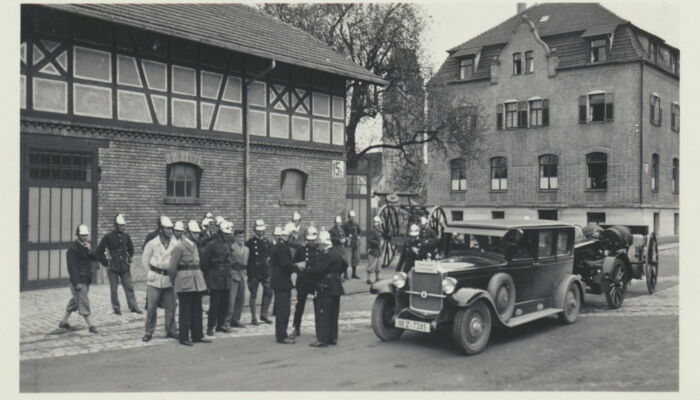 old fire truck and firemen