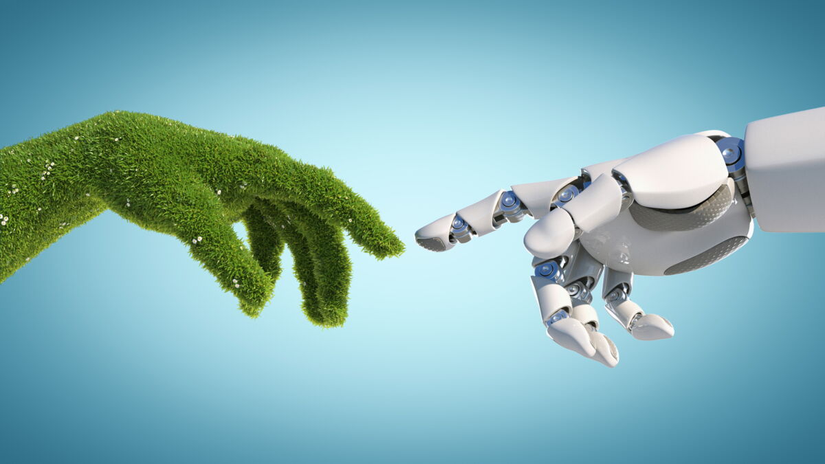 Hand aus Grass und Roboterhand